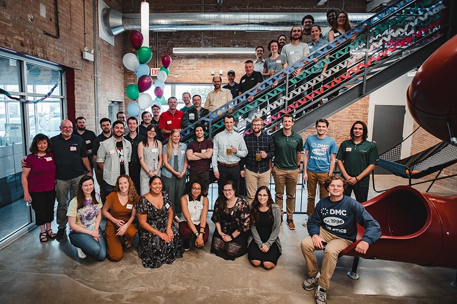 DMC_25th_Anniversary_Party_Group_Photo_Chicago_Next_to_Slide