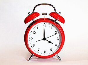 Image of a red alarm clock.