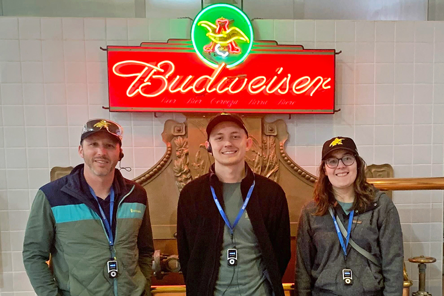 DMC STL colleagues under a Budweiser sign