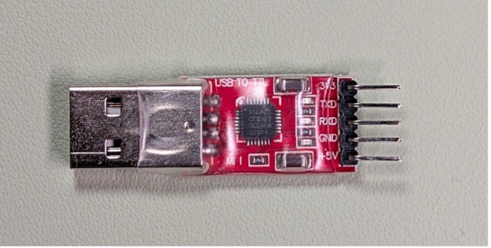 Red and black USB-UART adapter